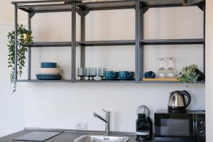 Kuchyň nebo kuchyňský kout v ubytování Verona Suites and Rooms