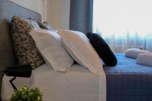 Postel nebo postele na pokoji v ubytování Verona Suites and Rooms
