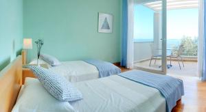 Posteľ alebo postele v izbe v ubytovaní Corfu Luxury Villas