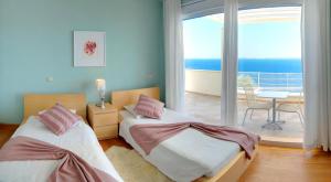 Posteľ alebo postele v izbe v ubytovaní Corfu Luxury Villas