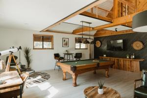 a living room with a pool table in it at Lovers nest by Casa Oso with private hiking trails and pond in Mariposa