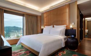 Voodi või voodid majutusasutuse Galaxy Macau toas