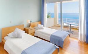 Posteľ alebo postele v izbe v ubytovaní Corfu Luxury Villas