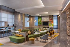 TV a/nebo společenská místnost v ubytování Home2 Suites by Hilton Guiyang Airport