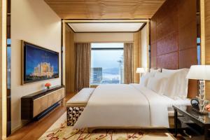 Voodi või voodid majutusasutuse Galaxy Macau toas