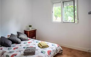 a bedroom with a bed and a window at 1 Bedroom Nice Home In Xativa in Xàtiva