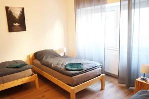 Postel nebo postele na pokoji v ubytování cozy 3-room Apartment