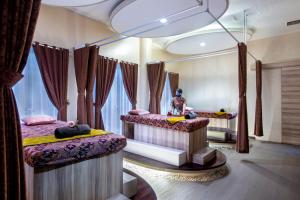 Voodi või voodid majutusasutuse Palace Hotel toas