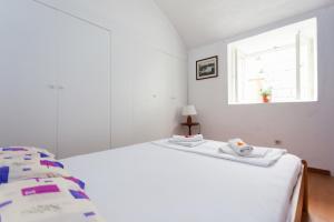 Кровать или кровати в номере Apartment Capitano Blue