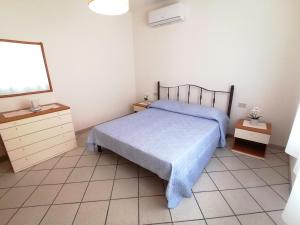 Кровать или кровати в номере Appartamento Giansy