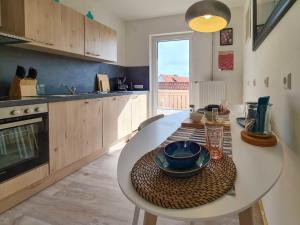 a kitchen with a table with a plate on it at Ferienwohnung Frieda - a63776 in Bad Sachsa