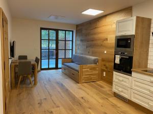 Kuchyň nebo kuchyňský kout v ubytování Wellness apartmán Pila Kvilda