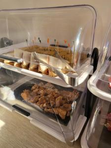 a refrigerator filled with lots of food at La Vucciria di Guttuso in Palermo