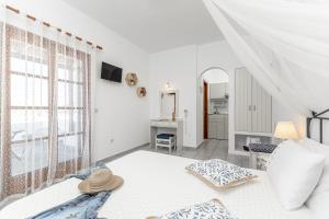 Postel nebo postele na pokoji v ubytování Zanneta Apartments & Suites