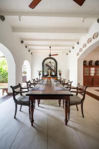 a large dining room with a large table and chairs at 42 Lighthouse Street in Galle
