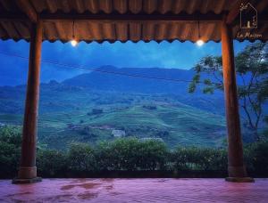 a view from a gazebo of a mountain at La Maison House & Bungalow in Sa Pa