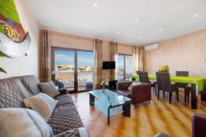 a living room with a couch and a table at Lagos Terrace Villa in Lagos