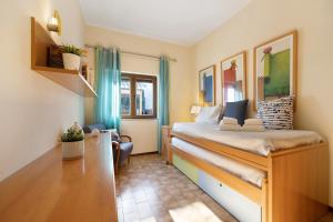 a small room with a bed and a chair at Lagos Terrace Villa in Lagos