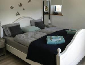 Кровать или кровати в номере Ferienwohnung Waldhof