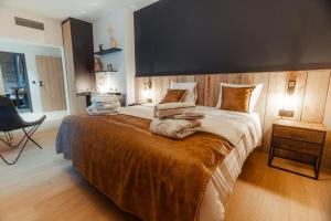 Postel nebo postele na pokoji v ubytování Domaine des Thermes