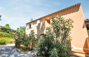 a house with plants in front of it at Awesome Apartment In Sainte-Maxime in Sainte-Maxime