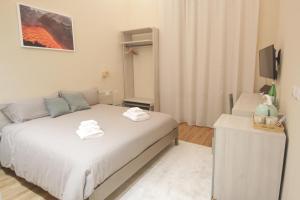Etna Vibes Home客房内的一张或多张床位