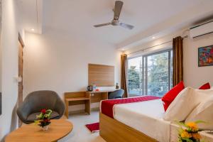 Postel nebo postele na pokoji v ubytování Octave Nirvana Suites