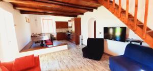 A kitchen or kitchenette at DIMORA IL CAMALEONTE apartments in nature with pool