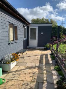 a patio in front of a house at The Snuggery Broadclyst in Exeter