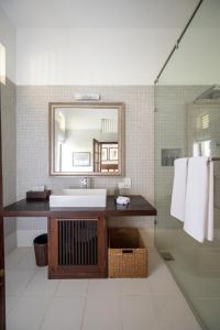 a bathroom with a sink and a mirror at 42 Lighthouse Street in Galle
