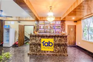 a restaurant with a bar with a sign that reads igloo hotels at FabHotel Rikhila's Regency in Gangtok