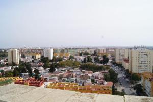 una vista aérea de una ciudad con edificios en ROCH - Stylish Apartment near Metro, en Sevilla