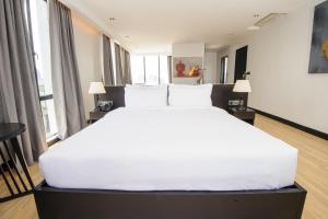 Katil atau katil-katil dalam bilik di GLOW PARK HOTEL Grand Royal Palace
