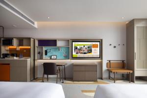 Rúm í herbergi á Home2 Suites by Hilton Shanwei Lufeng