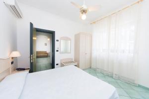 Кровать или кровати в номере La Residenza Aparthotel