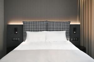 Postel nebo postele na pokoji v ubytování Hotel Halo Szczyrk