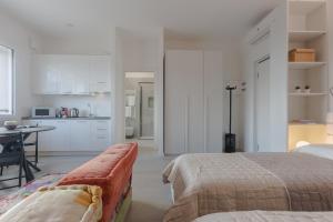 Säng eller sängar i ett rum på Bologna Tecnopolo Utamaro apartment