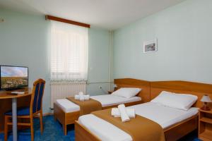 Кровать или кровати в номере HOTEL KRALJEVICA