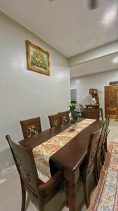 a dining room with a table and chairs at Sand Dune Villa in Kampong Beting Lintang