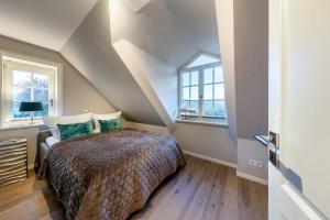 Postel nebo postele na pokoji v ubytování Haus Sylter Träume