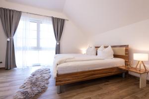 Postel nebo postele na pokoji v ubytování Landhofmühle