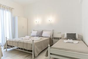 Posteľ alebo postele v izbe v ubytovaní Katerina Babis Studios + 37 fotografií