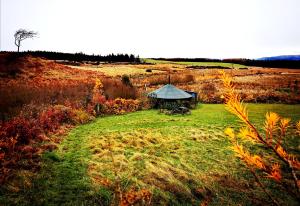 a gazebo in the middle of a field at The Round House in Newton Stewart