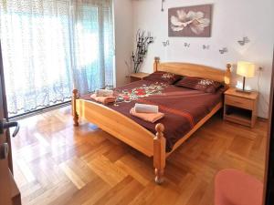 Postel nebo postele na pokoji v ubytování Mira Apartment