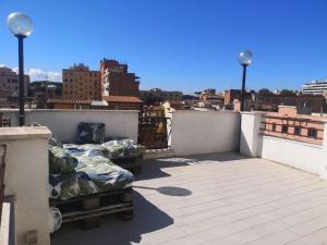 a balcony with two beds on a roof at Soulmate Rooftop Apartment in Rome
