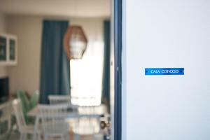 a close up of a door with a sign on it at Seabay in Golfo Aranci