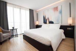 Katil atau katil-katil dalam bilik di GLOW PARK HOTEL Grand Royal Palace