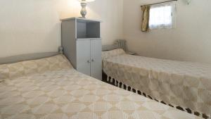 Posteľ alebo postele v izbe v ubytovaní Les Ondines 2- 33- Maison mezzanine- 6 pers
