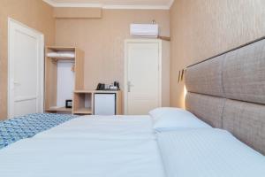Voodi või voodid majutusasutuse MY HOTEL toas