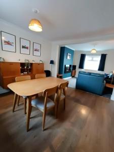 a living room with a table and a couch at Family friendly home Saltburn with Seaview in Skelton